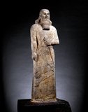 Ashurnasirpal II succeeded his father, Tukulti-Ninurta II, in 883 BC. During his reign he embarked on a vast program of expansion, first conquering the peoples to the north in Asia Minor as far as Nairi and exacting tribute from Phrygia, then invading Aram (modern Syria) conquering the Aramaeans and neo Hittites between the Khabur and the Euphrates Rivers.<br/><br/>

His harshness prompted a revolt that he crushed decisively in a pitched, two-day battle. According to his monument inscription while recalling this massacre he says 'their men young and old I took prisoners. Of some I cut off their feet and hands; of others I cut off the ears, noses and lips; of the young men's ears I made a heap; of the old men's heads I made a marinet. I exposed their heads as a trophy in front of their city. The male children and the female children I burned in flames; the city I destroyed, and consumed with fire'.<br/><br/>

Following this victory, he advanced without opposition as far as the Mediterranean and exacted tribute from Phoenicia. On his return back home he moved his capital to the city of Kalhu (Nimrud).